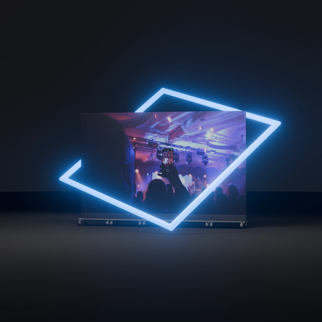 Render: ekran LED Inspiring Vision wyświetlający scenę koncertową z dłonią robiącą zdjęcie telefonem, otoczony niebieskim neonowym kwadratem